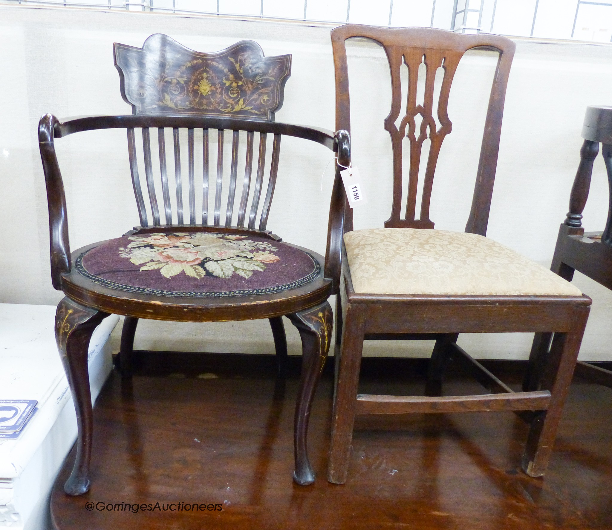 An Edwardian marquetry inlaid mahogany elbow chair and a George III provincial oak dining chair